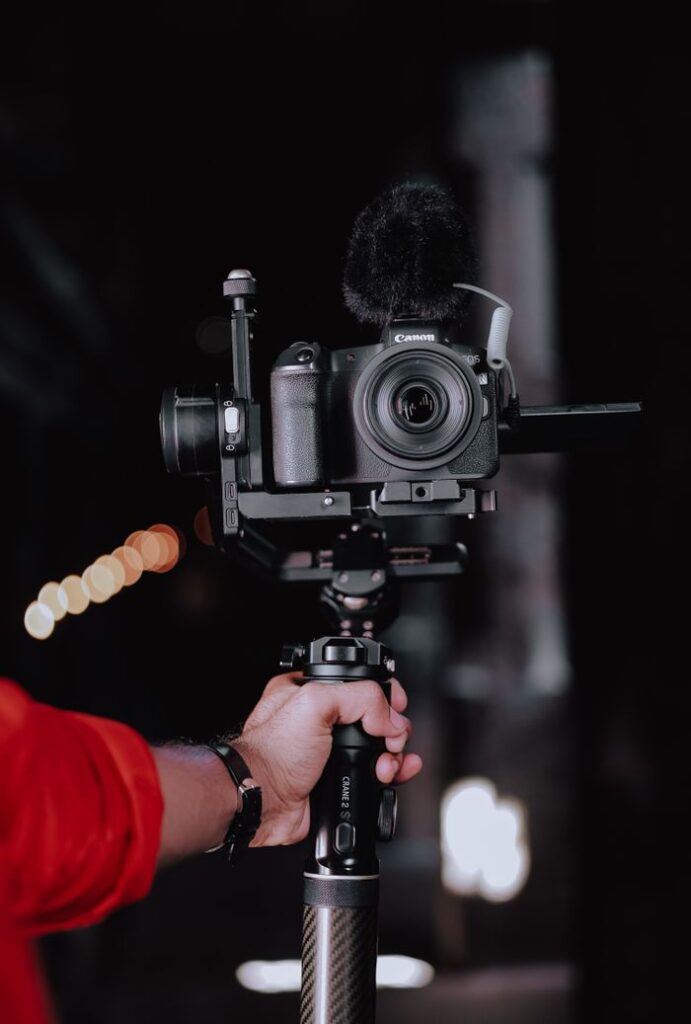 Close-up shot of a professional camera setup on a stabilizer indoors.